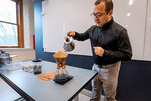 José Andino Martinez pours coffee