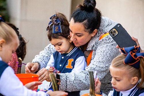 A student volunteering with children